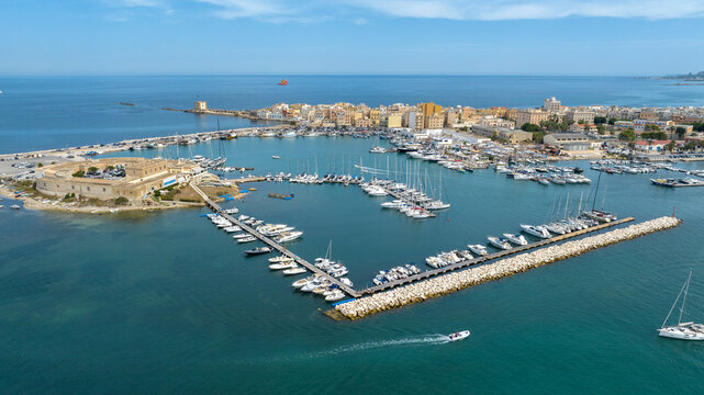 Aerial view of the port of Trapani, Sicily, Italy. It is a tourist harbor on the Mediterranean Sea. There are many small boats moored there.