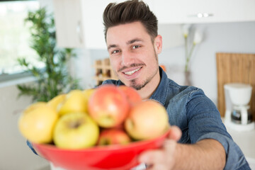 portrait of man with apples