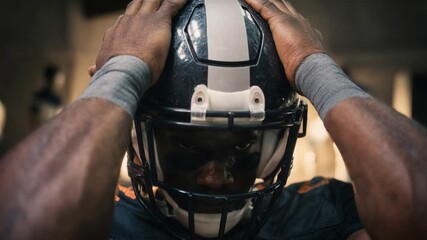Intense close‑up of a football player adjusting his helmet before the play, sweat, breath, and lights building raw anticipation—iconic sports moment for brand grit, training programs