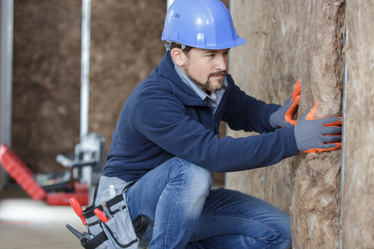 plasterer worker during insulation works