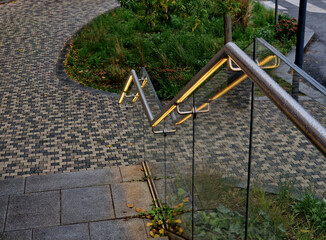 from the bottom of the handle is a recessed LED strip with a yellow light. the side of the stair...