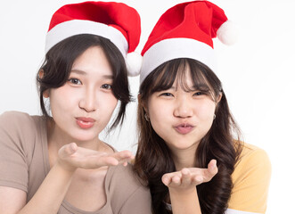 Girls in Santa's caps having fun