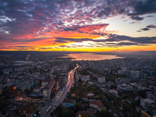 Dramatic sunset over Varna city and Verna lake and temple building  The Cathedral of Assumption aerial panorama above downtown during sunset