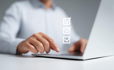 Focused businessman and hr professional using data driven management for workforce planning. Completing checklist on laptop showing efficient performance and quality