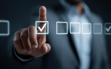 Focused businessman makes data driven decision for hr management and workforce planning. professional hr person completes task on virtual checklist