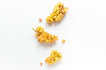 Many fresh green grape clusters isolated on white background.