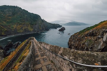 Stone Stairs Path to Gaztelugatxe Hermitage Basque Coast, Cloudy Atlantic Landscape