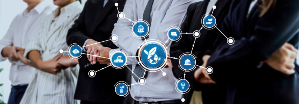 A diverse professional team stands in a modern office, showcasing collaboration through business strategy icons, symbolizing growth and innovation in a connected world. Amity