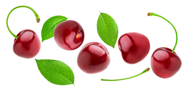 glossy, loose red cherries and scattered fresh green leaves captured mid-air, generating a vibrant, dynamic floating composition isolated on black.