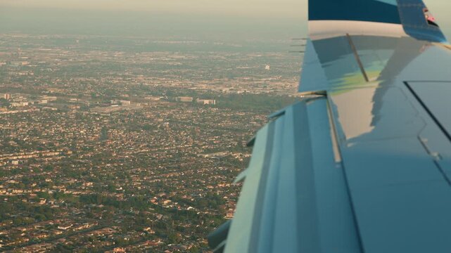 view from airplane window seat on approach to LAX