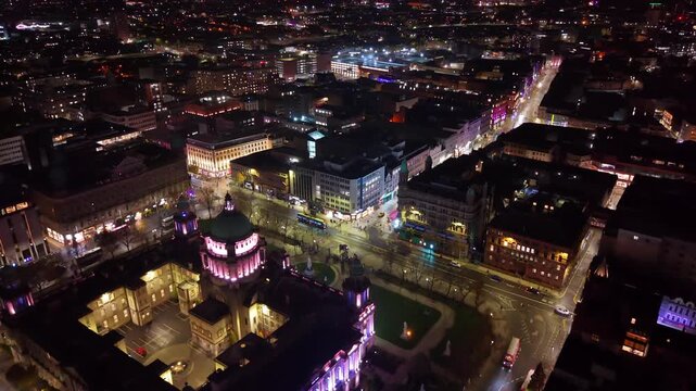 Overhead 4K 60FPS aerial of the Belfast City Centre skyline and the surrounding area at night. Produced in Northern Ireland with Rec709 color profile.