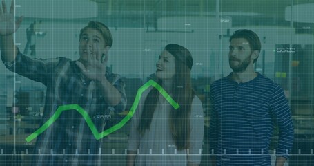 Pointing man in plaid shirt highlighting data on digital display at modern office, green line graph