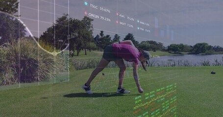 Bending golfer in pink polo placing golf ball on tee beside lake, with stock charts overlay