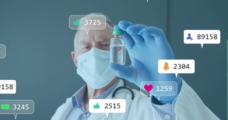 Masked gloved doctor with stethoscope holding green-capped vial at clinic with social icons