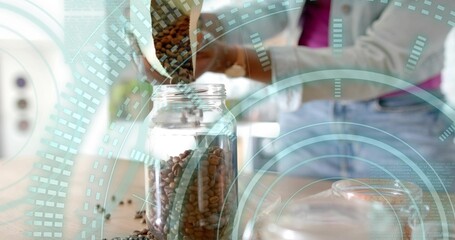 Woman pouring coffee beans from paper bag into glass jar in bright kitchen, with teal overlays