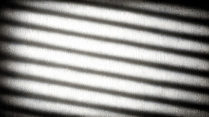 Shadows casting intricate lines against a textured surface, creating a captivating interplay of light and dark.