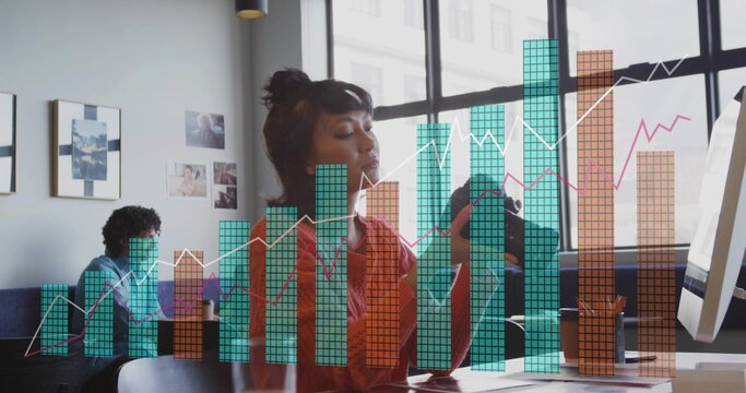 Asian woman inspecting DSLR camera lens in coworking lounge, with monitor and data chart overlay