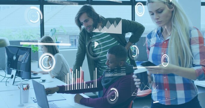 Collaborating office professionals reviewing data in open-plan office, with digital charts overlay
