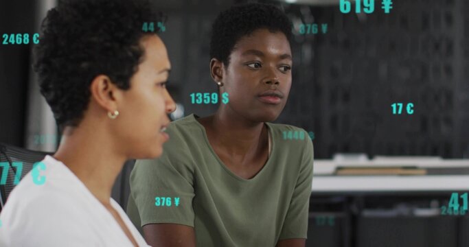 Analyzing businesswoman wearing olive t-shirt reviewing data overlays in office, digital metrics - Powered by Adobe