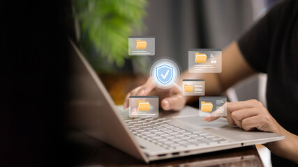 Secure document management on laptop with floating folder windows and shield check icon