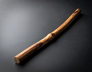 Rustic Wooden Stick on Dark Background - Natural Texture and Simplicity.