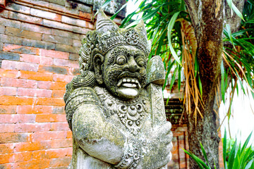 Ancient stone guardian statue, a mystical figure with a fearsome expression, standing guard in a...