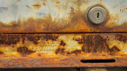 Texture background of an old iron door with rust and corrosion on the metal surface, creating a weathered, industrial,