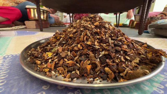 Close up of a plate full of ingredients used in havan puja in hindu tradition