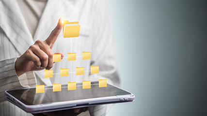 Digital folder hierarchy on tablet, businesswoman tapping virtual file structure for document management