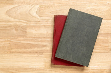 Stack of old book on wooden table for mockup blank template