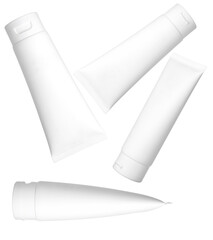 group of four white plastic cosmetic packaging tubes, dynamically positioned and scattered, isolated on a transparent background for skincare product visualization.