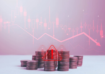 Stack of coins with red warning alert and falling stock graph, symbolizing financial crisis, market downturn, investment risk, economic loss, and business decline concept.