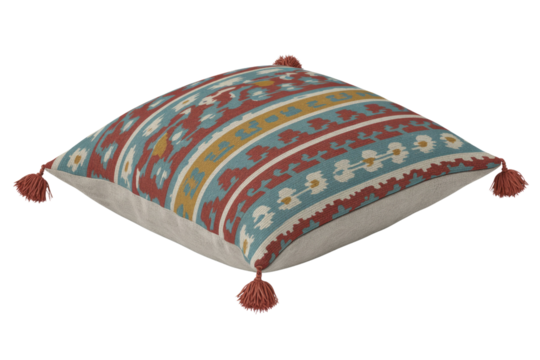 A decorative square throw pillow with a vibrant, intricate Kilim-style pattern in red, teal, yellow, and white, featuring corner tassels. background removed