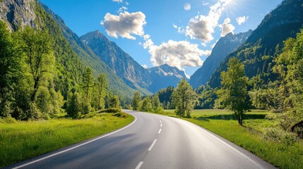 Fototapeta premium Serene Mountain Road with Lush Greenery and Clear Blue Sky