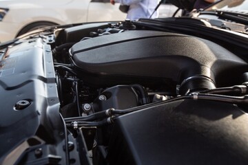 The vehicle open engine a car hood for safety test