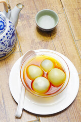 Black sesame dumplings in ginger syrup, Chinese sweet dessert