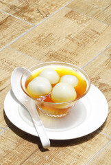 Black sesame dumplings in ginger syrup, Chinese sweet dessert