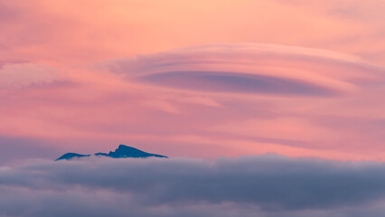 Landscape of lenticular clouds over Sierra Nevada (Granada, Spain) at sunset