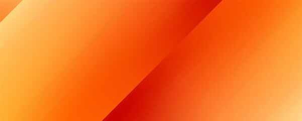 Warm orange yellow red gradient background. Autumn colored blurred wallpaper.