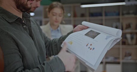 University students analyze data in charts and graphs. Teamwork and collaboration in a modern workspace. Business meeting and project discussion. - Powered by Adobe