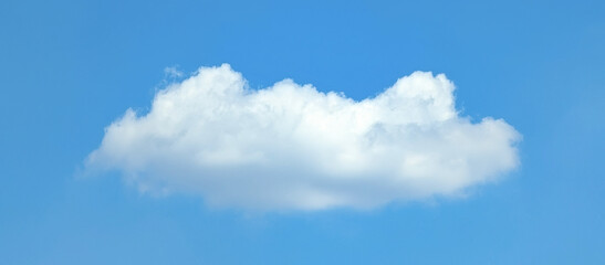 Blue sky with cloud. Mixed cumulus and cirrus clouds are scattered by the wind across the vast sky on light background.
