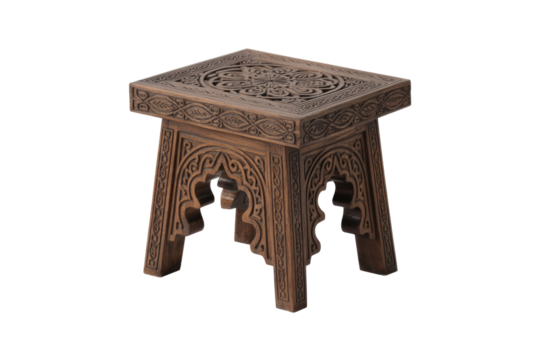 A beautifully carved dark brown wooden side table or stool with intricate Moroccan-inspired patterns, perfect for accentuating any room. background removed