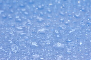 Water drops on glass. Raindrops were falling on the surface.