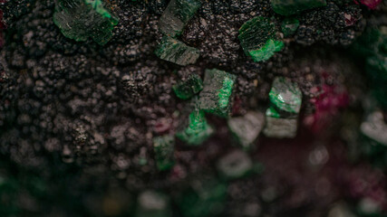 Macro Cobaltocalcite, Dioptase and Heterogenite mineral specimen from Congo under magnification...