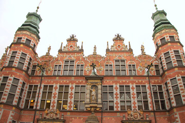 Naklejka premium Beautiful Mannerist Façade of the Great Armoury in Gdansk, Poland (now housed the Academy of Fine Arts) Latin: Year 1605 1768 Renewed 1887 
