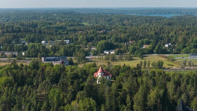 Drone circling the Majvik Villa and the road Keha 3, sunny day in Espoo, Finland