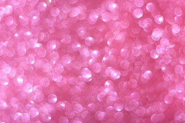 Soft pink bokeh background with glowing circular light spots in dreamy and festive atmosphere. For romantic designs, holiday decorations, Valentines themes, celebration visuals, creative projects