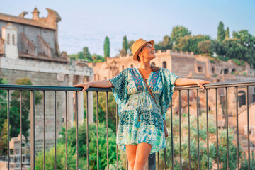08 08 2025 Rome, Italy - Woman tourist admiring ancient ruins at Roman Forum