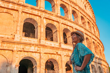 08 08 2025 Rome, Italy - Traveler standing near Colosseum arches