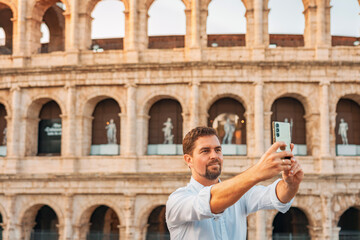 08 08 2025 Rome, Italy - Male traveler making selfie near Colosseum